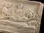 This marble plaque depicts a ‘parturition’, or birthing scene