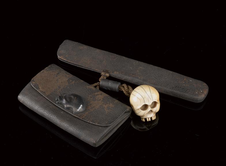 Tobacco pouch with pipe case and netsuke