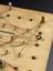 A wiring test comprised of a wooden board with 36 holes for