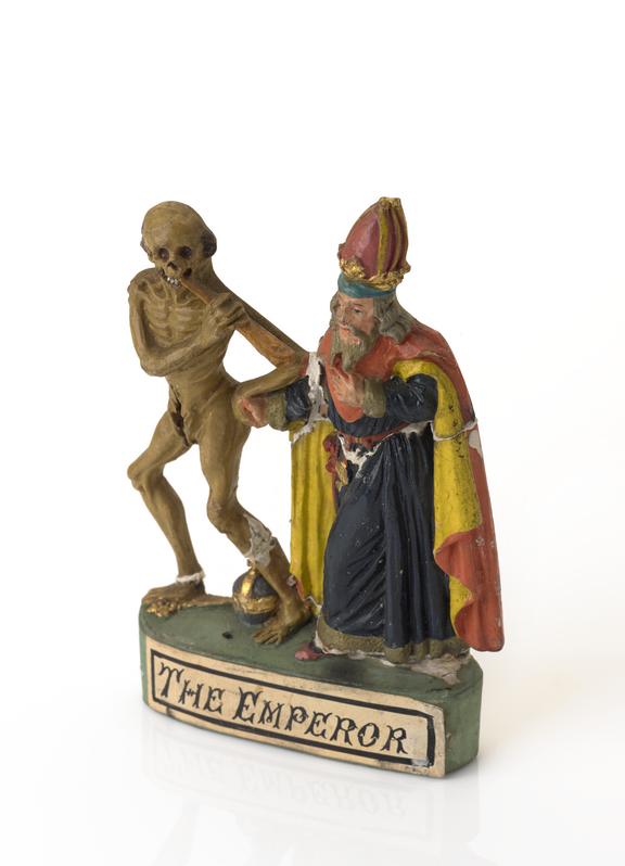 Plaster statue of cadaver leading bishop away by the hand