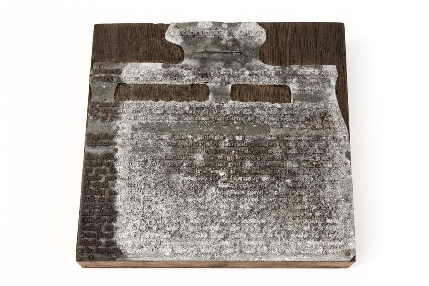 A printing block with a surface image of text