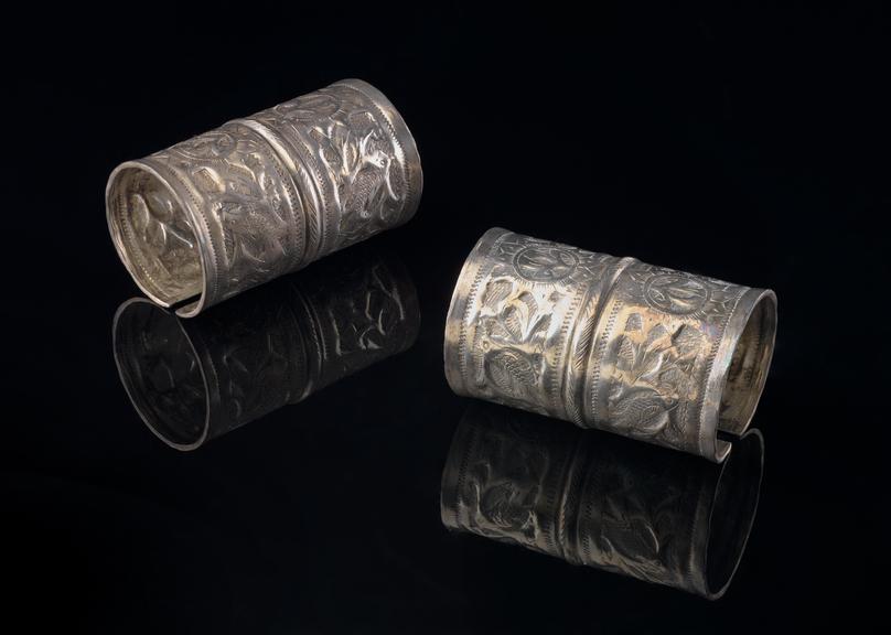 Pair of silver armlets, penannular, engraved decoration