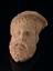 Votive male head, bearded, terracotta, hollowed back