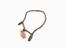 Bracelet of small polished stone beads with carved central
