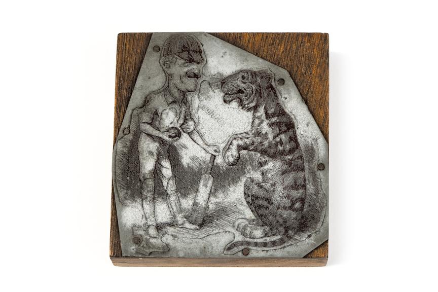 A printing block with an engraved surface depicting a cartoon