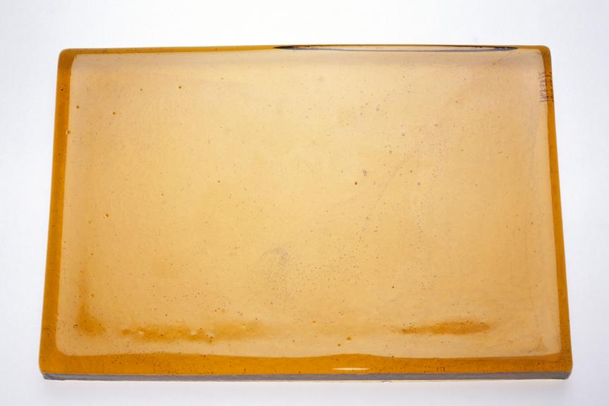 Slab of cast orange/red glass, 12" x 8" x 1", 1968