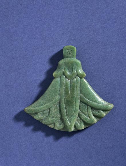 Pendant of carved and moulded green casein in form of papyrus