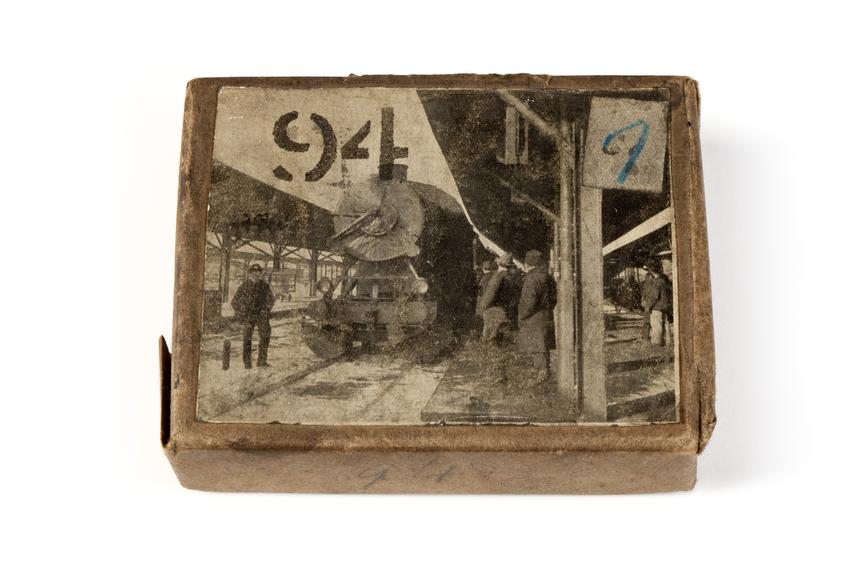 A printing block with a surface image of a locomotive at a