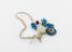 Amuletic beads, 1 large ovoid white bead, 1 resembling an eye