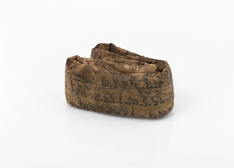 Charm, andwritten on reed which is now tightly folded into fragile ...