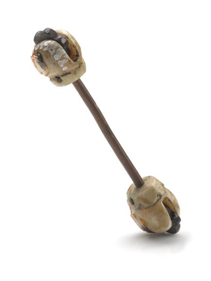 2 penis pins of brass with decorative bone end-pieces | Science Museum Group Collection