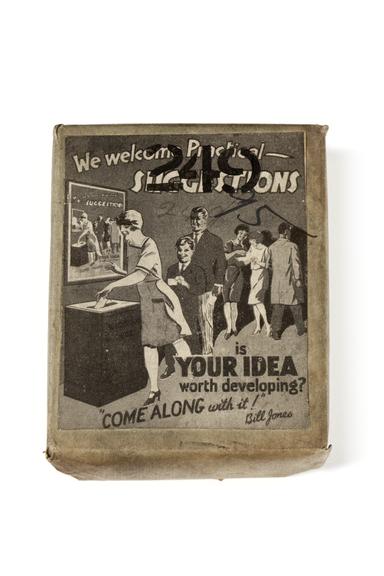 A printing block with a surface image advert: "We welcome