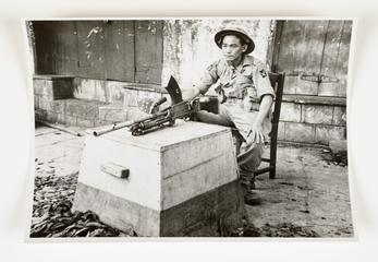 "A Gurkha Soldier, armed with a Bren gun, keeps guard in a riot area in Bombay"