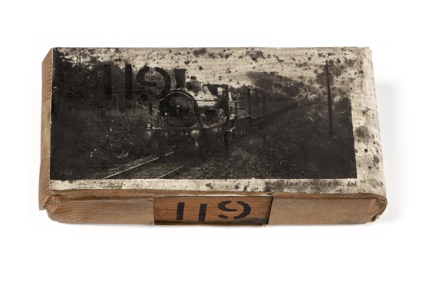 A printing block with a surface image of a tank engine