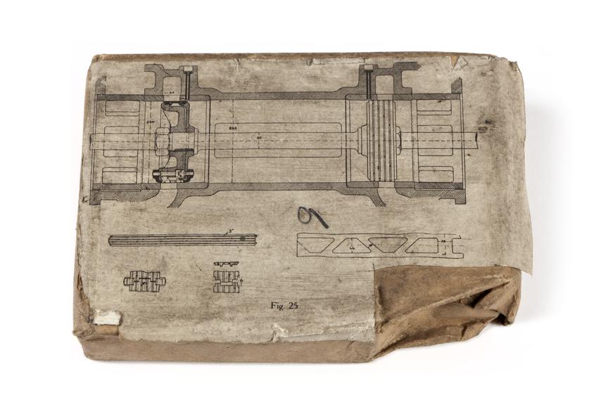 A printing block with a surface image of a locomotive section