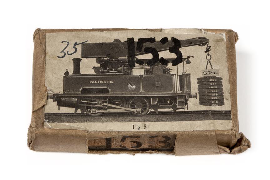 A printing block with a surface image of a locomotive crane