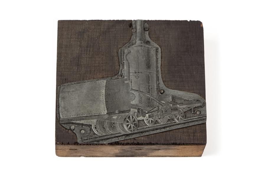 A printing block with a surface image of a locomotive or