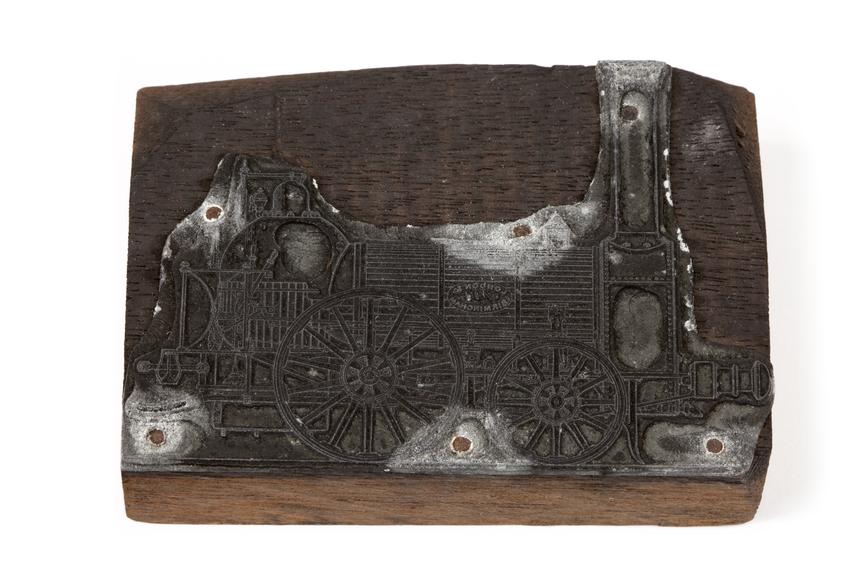 A printing block with a surface image of a locomotive
