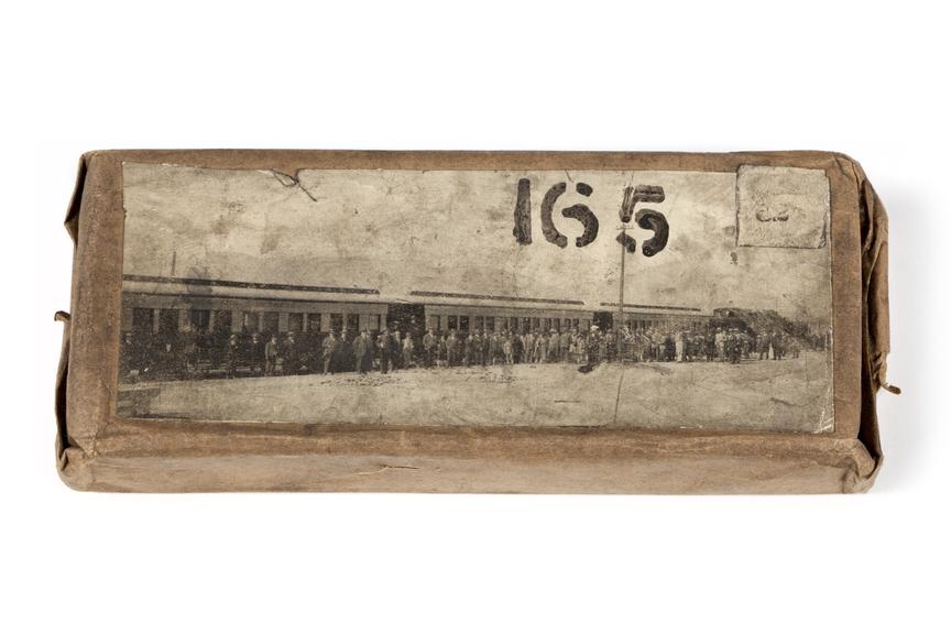 A printing block with a surface image of a train and a large