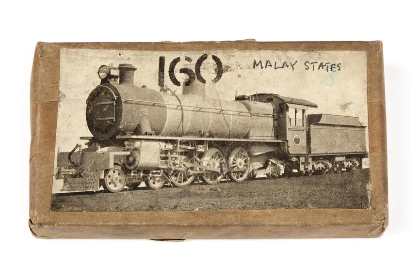 A printing block with a surface image of a locomotive for the