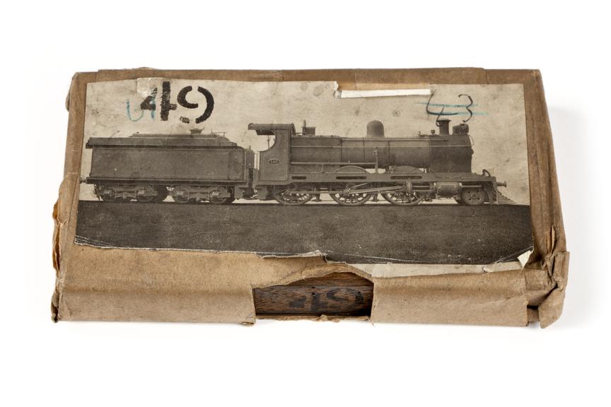 A printing block with a surface image of a locomotive for the