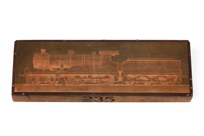 A printing block with a surface image of a SE&CR locomotive