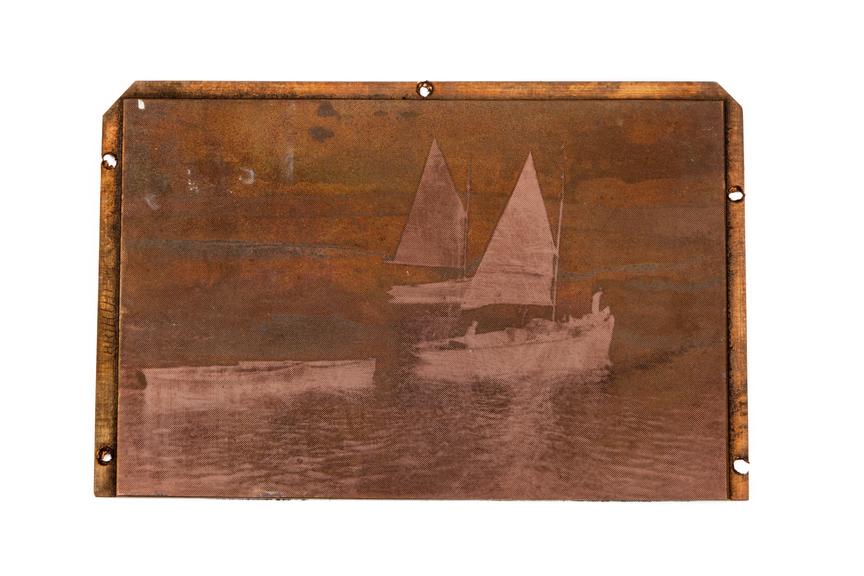 A printing block surface plate with an image of several sail