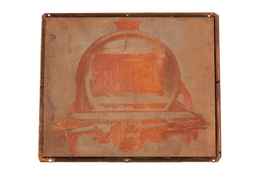 A printing block surface plate with an image of a locomotive