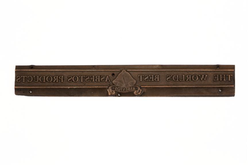 A printing block surface plate with the inscription "The