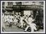 A photograph of a mob attacking a police van in Bombay