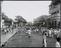 A photograph of a police man chasing a mob in Calcutta