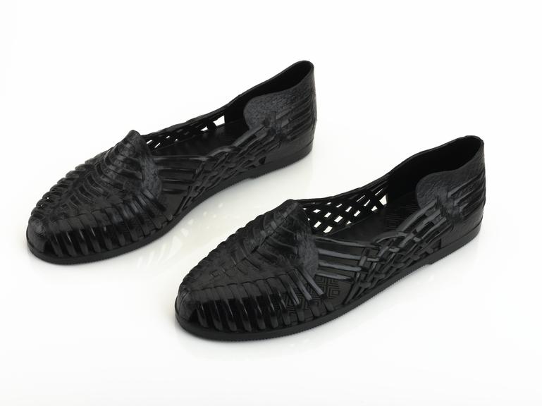 Pair of black PVC sandals, 1985