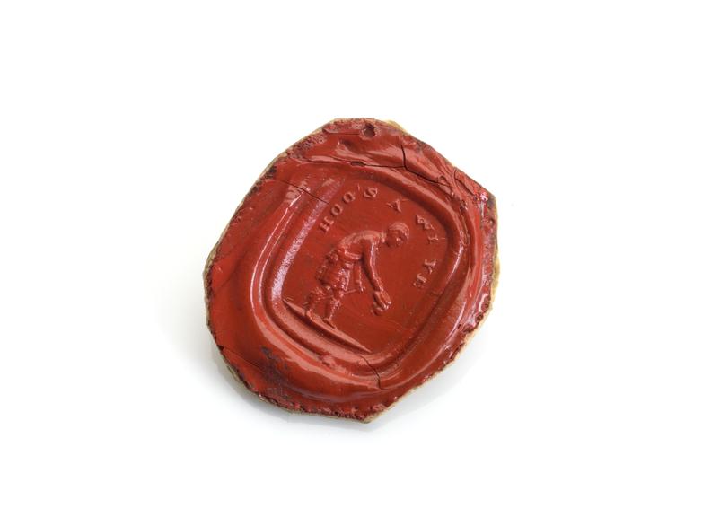 Red shellac seal with stamp showing male figure