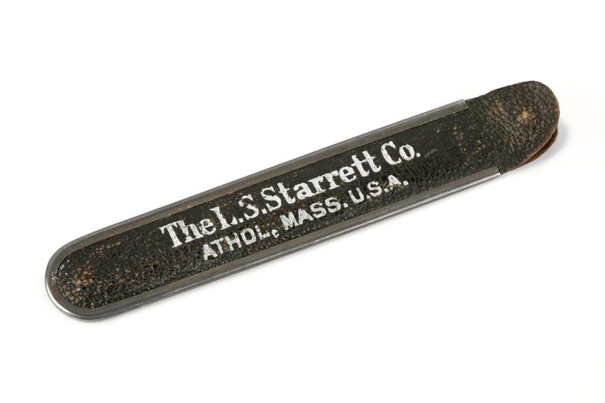 A 12-inch metal folding rule, made by the L.S