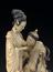 Ivory statuette showing woman breast feeding her old