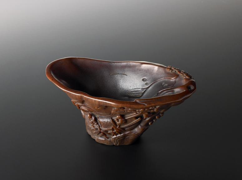 Rhinoceros horn cup, carved in relief on outside