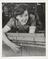 Photograph of young woman worker with technical equipment at