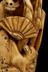 Netsuke in form of skeleton holding fan