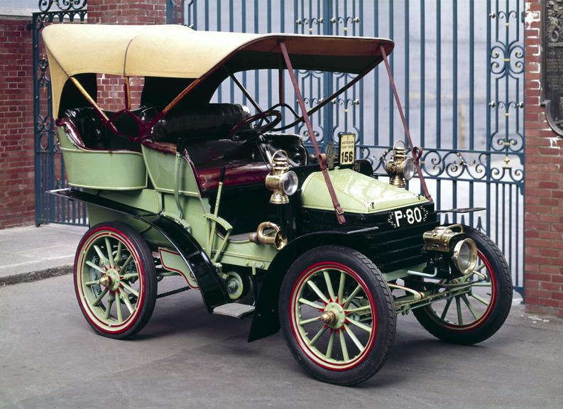 Wolseley 7.5 H.P. motor car, with side lamps, spare wheels, and Brighton run presentation tankard