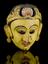 Painted wooden face mask, yellow with polychrome detail