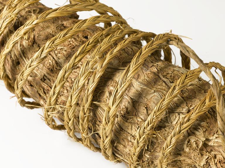 Roll of tobacco, large cigar shaped lump