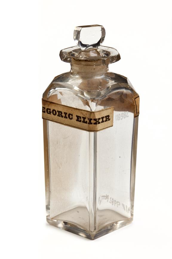 Glass bottle with glass stopper for paregoric elixir, empty