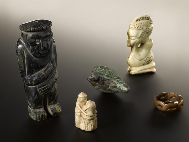 Stone amulet of man and woman embracing