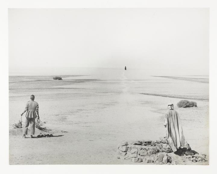 Peter O'Toole as Lawrence and Michel Ray as Farraj watching