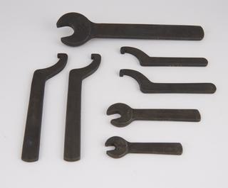 Four pin-spanners and three open-jaw spanners