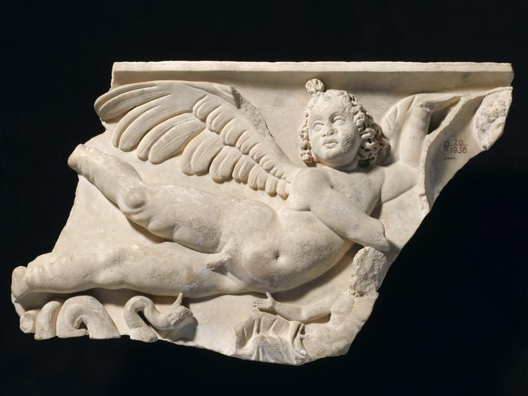 Fragment of a roman relief from a marble sarcophagus showing a