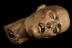 Carved wooden head of a christian martyr, ivory teeth