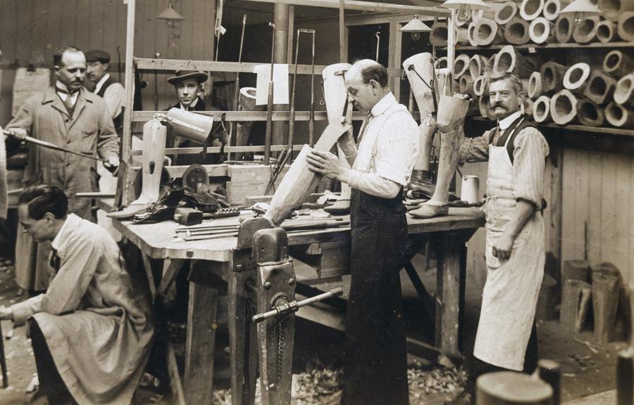 Making wooden prosthetic limbs during World War One, c1915-1918.