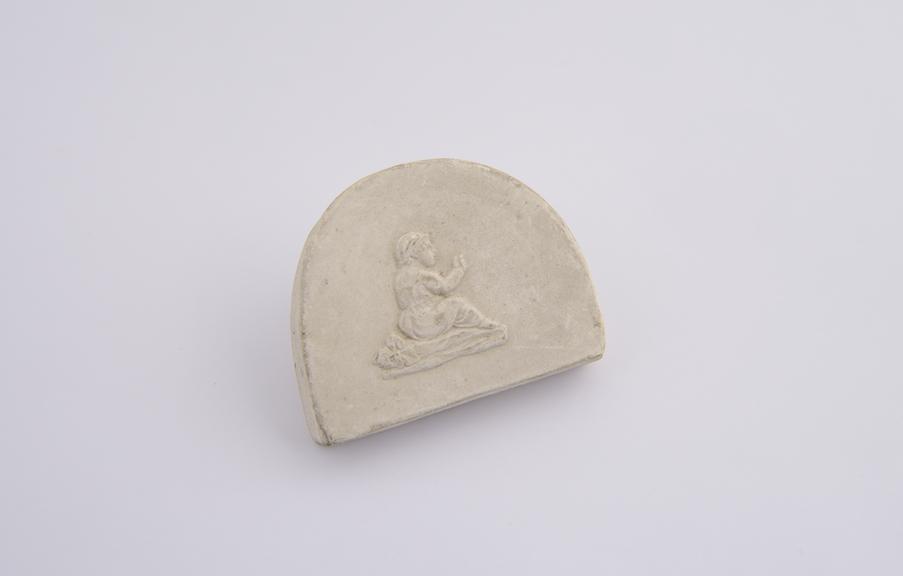 Plaster cast, girl seated, hand raised