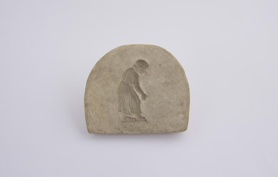 1 Plaster mould, figure of woman, bending forward